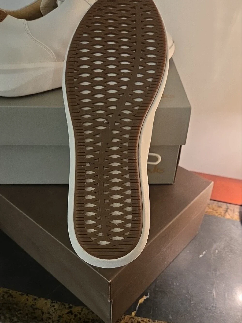 Clarks Cream Leather Sneakers with Brown Heel Accent and Gold Zip